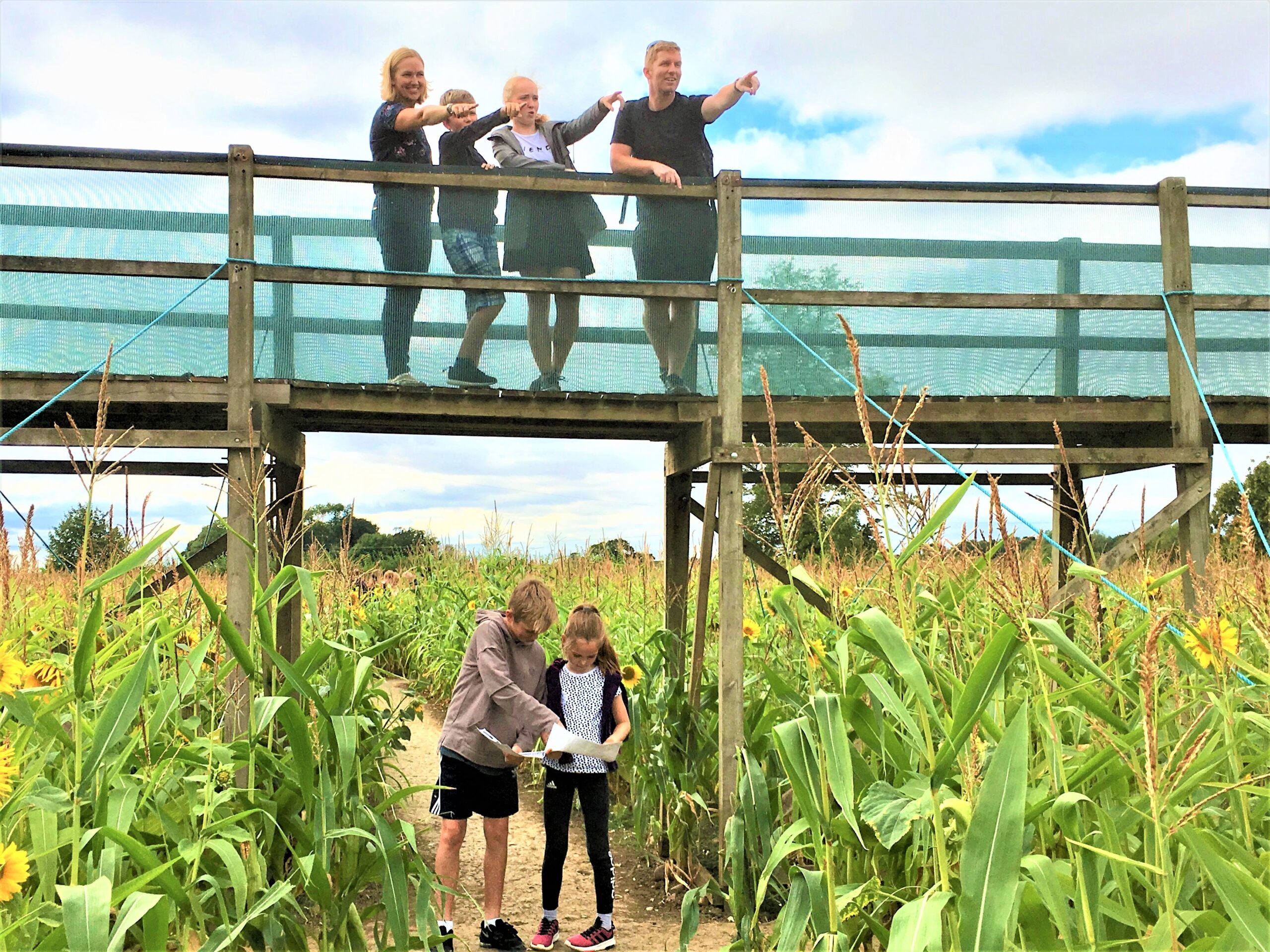 Family on a bridge at Wistow Maze